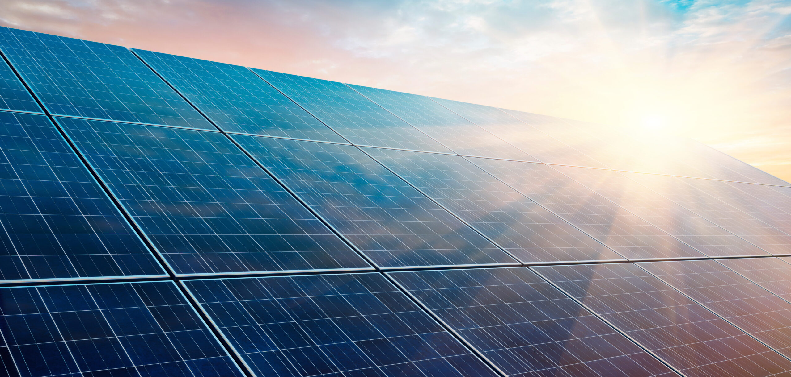 Solar power plant at sunset
